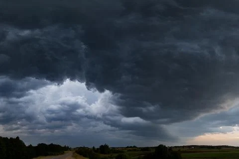 Dark Storm Clouds Rolling Over a Rural Landscape in Lithuania Stock Photos