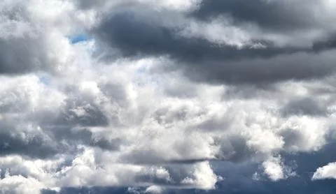 Dark storm clouds in the sky on a cloudy autumn day. Stock Photos