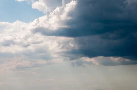 Dark storm clouds sky. Copy space below Stock Photos