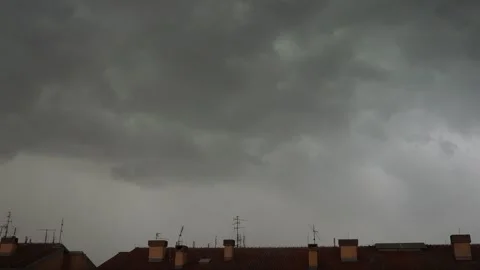 Dark Storm Clouds Swept Swiftly Through The Sky, Swirling Ominously Above The Stock Footage 326972095