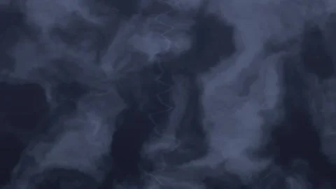 Dark storm clouds swirl in the sky during a thunderstorm Stock Footage 338286425