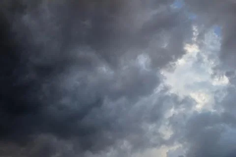 Dark storm clouds before a thunder-storm, natural background photo texture Stock Photos