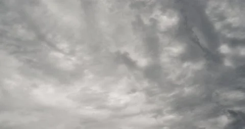 Dark storm small clouds spread across sky durng day. Rainy gray sky Stock Footage 155163594