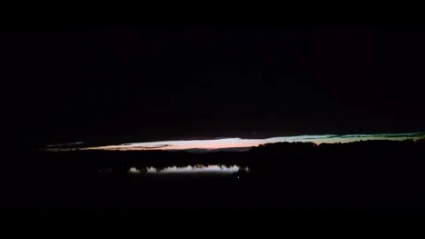 Dark Storm Time-Lapse of Last Sun Rays Fading Over Rural Lake Horizon Stock Footage 345309777