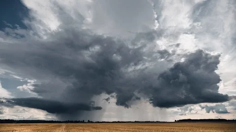 Dark stormy cloud going forward in the fields. Time lapse video. Video stock 94033249