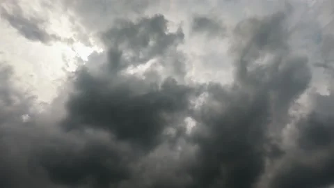 Dark stormy clouds covered bright sun Stock Footage 204869099