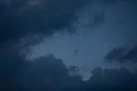 Dark Stormy Clouds at Dusk Stock Photos