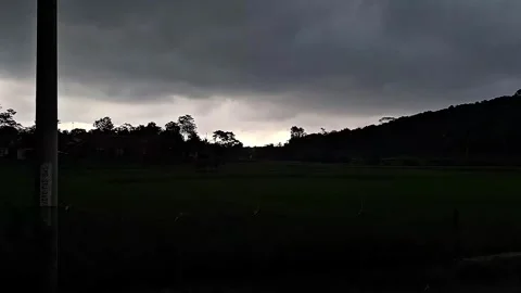Dark stormy clouds gathering over rural area view Stock Footage 337050967