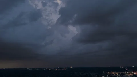 Dark Stormy clouds sky before heavy rainfall and lightning over suburban town . 库存影片 294129947
