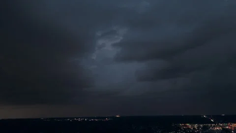 Dark Stormy clouds sky before heavy rainfall and lightning over suburban suburb Stock Footage 294130108