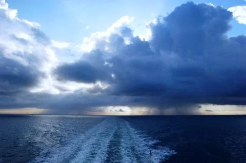Dark stormy clouds. View form car ferry Stock Photos