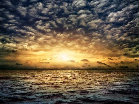 Dark stormy sea with a dramatic cloudy sky Stock Photos