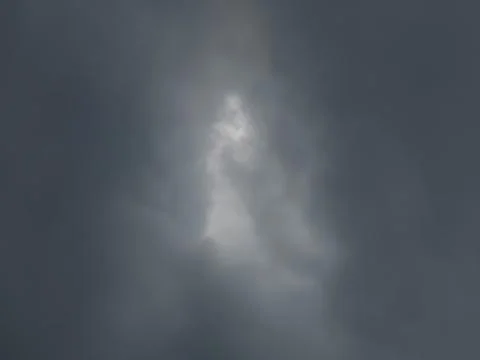 Dark stormy sky with dramatic glowing cloud formation, moody overcast weath.. 写真素材