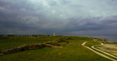 Dark stormy sky before the rain. Ancient lighthouse near Mediterranean Sea . Stock Footage 74204963