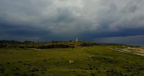 Dark stormy sky before the rain. Ancient lighthouse near Mediterranean Sea . Stock Footage 74221469