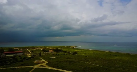 Dark stormy sky before the rain. Ancient lighthouse near Mediterranean Sea . Stock Footage 74221479