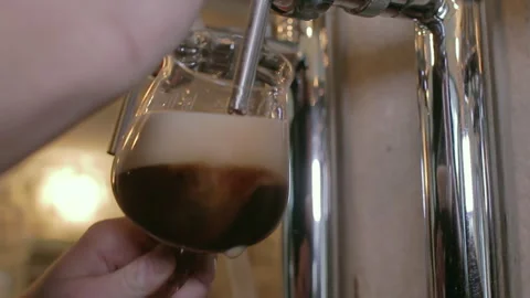 Dark Stout Beer Pouring Into Stemmed Glass Close Up Stock Footage 344296159