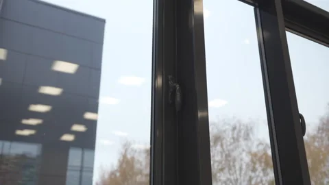 Dark stylish frame surrounds wide transparent window Stock Footage 310778387