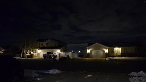 Dark suburban shot at night. Clouds and planes overhead. Time lapse. Vídeo Stock 84967807