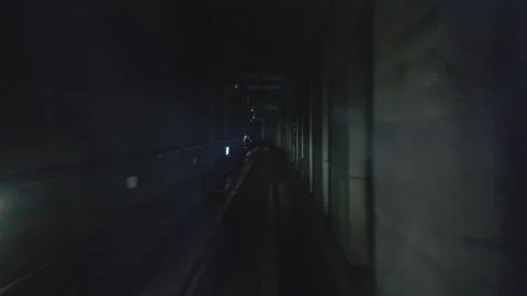 Dark Subway Tunnel with Train Approaching in Seoul Stock Footage 340241977