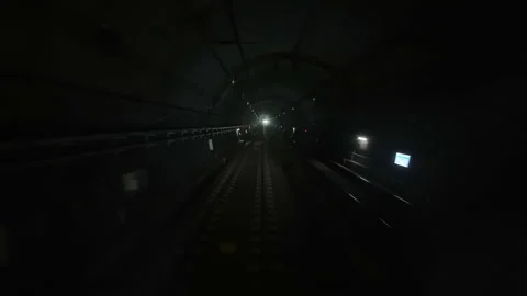 Dark Subway Tunnel with Train Lights in Distance Seoul Stock Footage 340242061