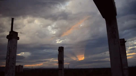 Dark sunset with rays over destroyed area Stock Footage 25891849