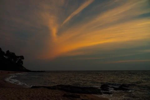 Dark sunset on the sea Stock Photos