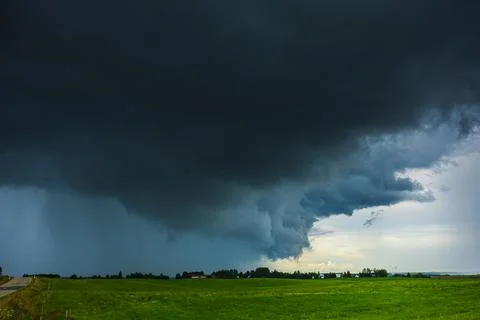 Dark supercell storm clouds with massive rain. 스톡 사진