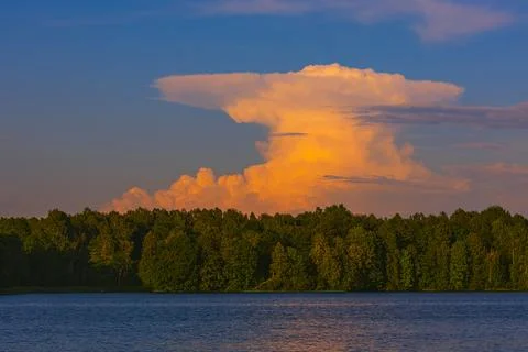 Dark supercell storm clouds with massive rain shaft. Stock Photos