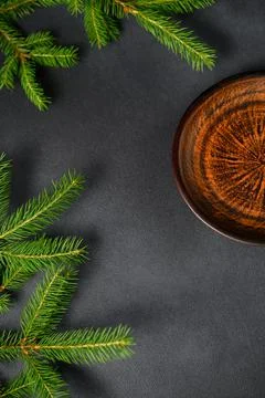 Dark table with Green Christmas Tree Branches on Left. Table with an empty pl Stock Photos