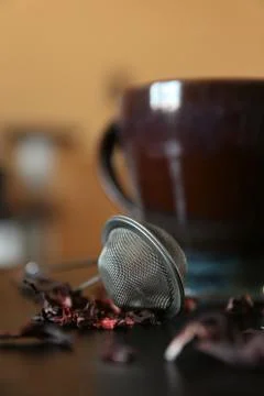 Dark table tea composition. Brown cup. Orange background Stock Photos
