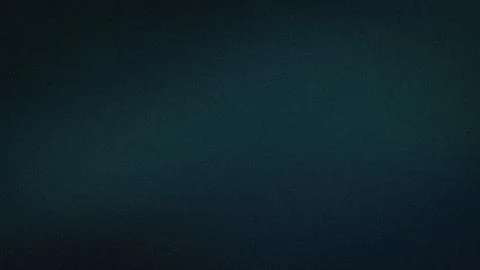 Dark teal grainy abstract background with blurred gradient effect in 4K res.. Stock Photos