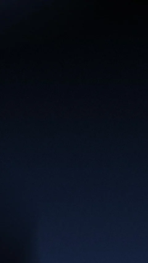 Dark teal textured gradient background with soft grain effect. Seamless loop Stock Footage 309701649