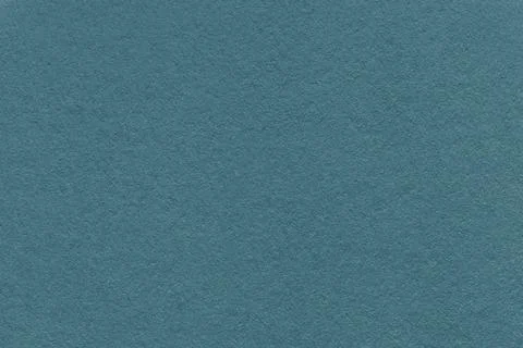 Dark teal textured paper background with subtle grain surface and soft stru.. Illustrazione stock