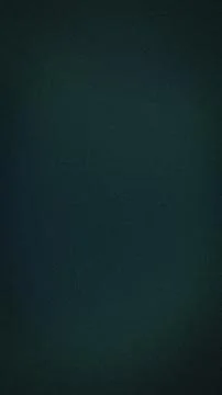 Dark teal textured vertical background with grainy gradient blur abstract g.. Stock Photos