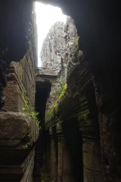 Dark Temple Corridor With Stone Face View In Bayon, Cambodia Foto stock