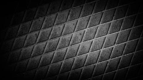 Dark textured background featuring a metal-like grid pattern with gray and .. Stock Illustration