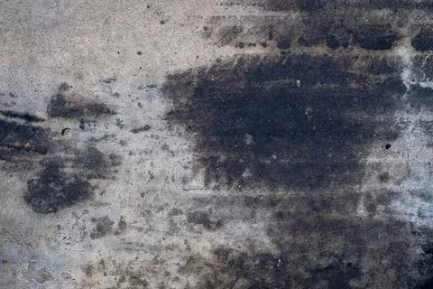 Dark textured concrete wall surface with rough pattern Stock Photos