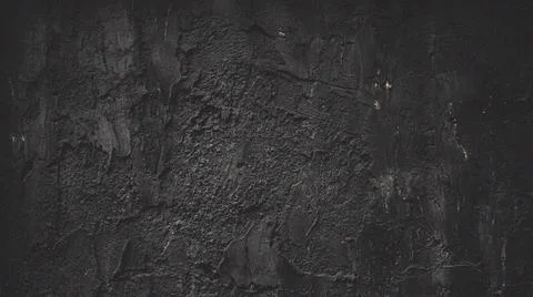 Dark textured stone wall background. Fotos Stock