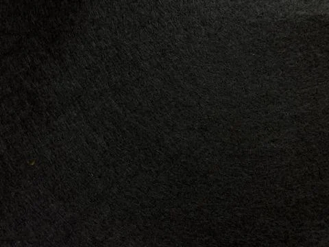 Dark textured surface background with subtle patterns and shadows Stock Photos