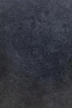 Dark textured surface showing a subtle pattern ideal for creative backgrounds 写真素材
