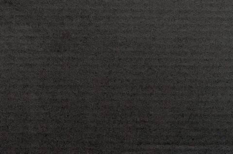 Dark textured surface with subtle patterns under soft lighting in minimalis.. 스톡 사진