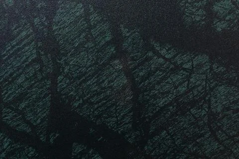 Dark textured surface with subtle patterns resembling natural stone in various Stockfoto's