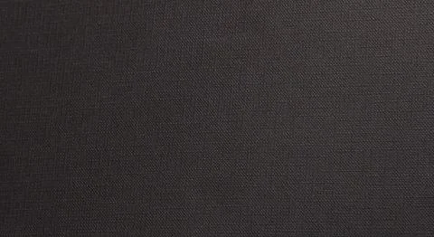 Dark textured surface with a subtle woven pattern and a matte finish.. Foto stock