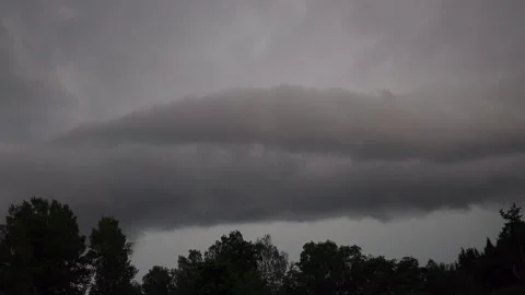 Dark thunder clouds during summer night in Sweden Stock Footage 135032653