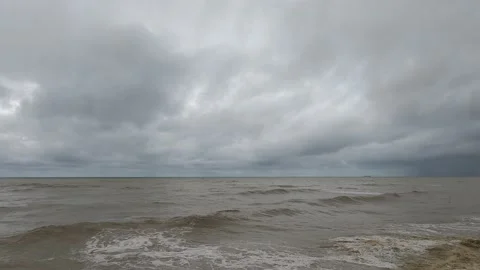 Dark thunder rain storm cloud on raging sea water n rough ocean wave Stock Footage 167062611