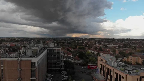 Dark thunder storm clouds rolling over city of Romford, London. 4K, UHD Stock Footage 93691544