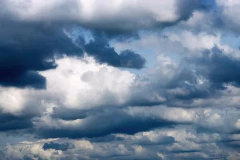 Dark thunderclouds in the cloudy sky Stock Photos