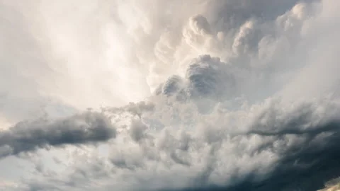 Dark thunderclouds rolling through sky in dramatic storm scene background Stock Footage 334932576