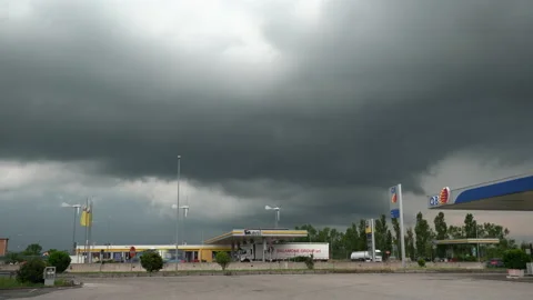 Dark Thunderstorm Clouds over Highway in Italy. Gas Station and Truck Stop Stock Footage 158404234